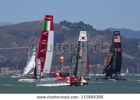 SAN FRANCISCO, CA - AUGUST 26: American team and the Corean team try to overtake the Italian team in the bay of San Francisco during the final of the America's Cup 2012. Aug 26 2012