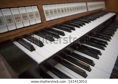 Close up view of a church organ in Lourdes, 2013. The organ is a musical instrument commonly used in churches or cathedrals.