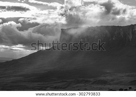 Kukenan tepui with falls in the clouds. Black and white. Mount Roraima, Gran Sabana. Venezuela 2015.