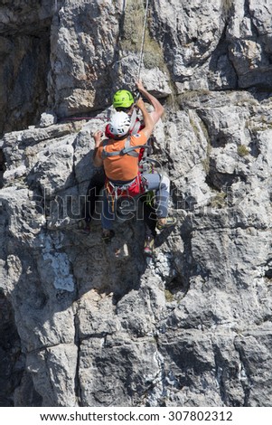CORTINA D'AMPEZZO, ITALY, June 08: Mountain rescue team members in action in the mountains of Dolomites also known as the Soccorso Alpino - June 8th 2014 in Italy.