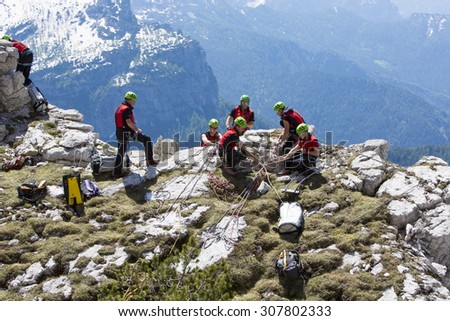 CORTINA D\'AMPEZZO, ITALY, June 08: Mountain rescue team members in action in the mountains of Dolomites also known as the Soccorso Alpino - June 8th 2014 in Italy.