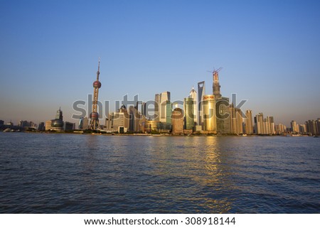 SHANGHAI, CHINA, APRIL 2: The Sunset on the Pearl Tower and Pudong skyline with the river. China 2013