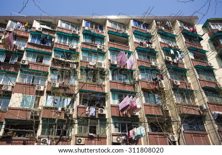 SHANGHAI, CHINA, APRIL 7: Popular residential building in Shanghai with blue sky. China 2013