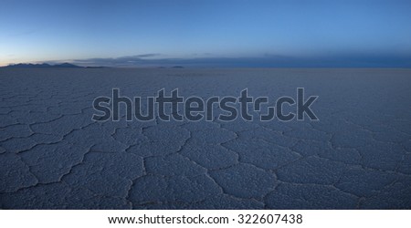 View of the Salar of Uyuni early in the morning during the dry season, the salt plains are a completely flat expanse of dry salt. Bolivia