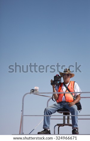 BONNEVILLE SALT FLATS, UT,  SEPTEMBER 8: Video Camera Man working at the World of Speed at Bonneville Salt Flats Recreation Area. Utah, USA 2012