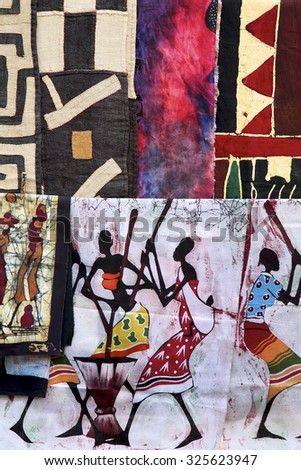 SWAKOPMUND, NAMIBIA, DEC 14: Colored paintings on fabrics made by unknown artist displayed in a craft market in Swakopmund. Namibia 2006 (Selective focus)