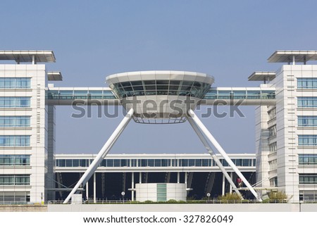 SHANGHAI, CHINA, MAY 2: Modern offices building with a top floor restaurant at the Shanghai airport in Pudong. China 2013