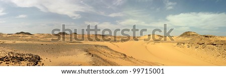Panoramic view. Sandy and deserted landscape in the Libyan desert.