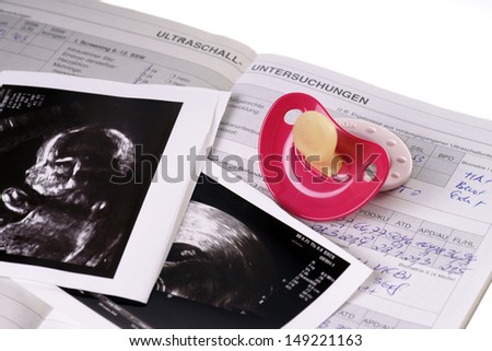 Mother card with pacifier and ultrasound image / pregnancy