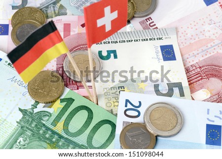 euro money with germany flag and swiss flag / tax evasion