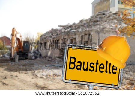 Demolition house with sign and the german word construction / construction zone
