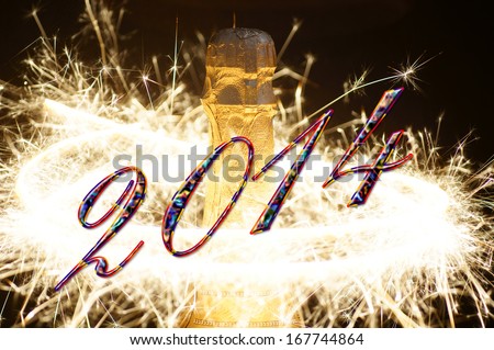 Champagne bottle with fireworks and the year number 2014 / New Years Eve