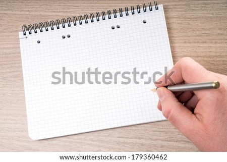 blank writing pad with hand and pen / blank writing pad