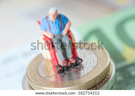 Old man in a wheelchair with money / wheelchair users