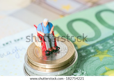 Old man in a wheelchair with money / wheelchair users