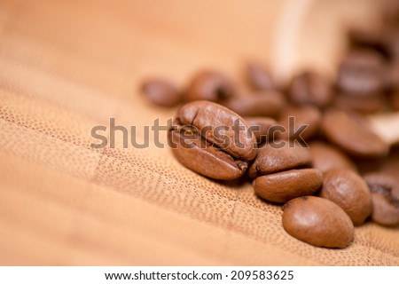 Coffee beans on a wooden board / Coffee