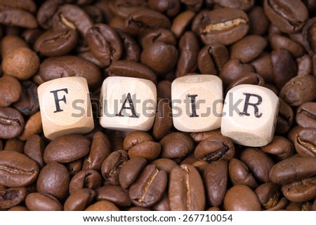 coffee beans with the word fair / Fair Trade