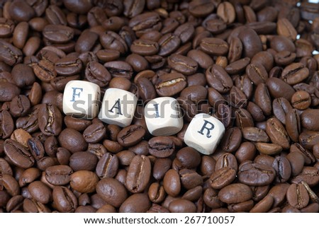 coffee beans with the word fair / Fair Trade