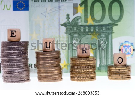 Money stack and wood dice with the word Euro / Euro Money