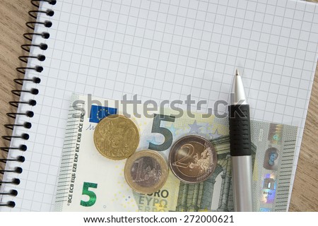 Blank writing pad with a pen and euro money / writing pad
