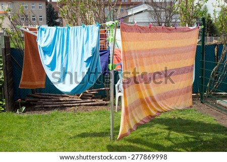 washed clothes on a clothesline / washed clothes
