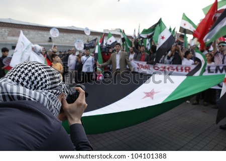 ISTANBUL-MAY 31: Unidentified activists participate in a march organized by Humanitarian Relief Foundation to commemorate Mavi Marmara raid on second anniversary on May 31,2012 in Istanbul,Turkey.