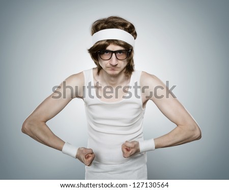 Funny Retro Nerd Flexing His Muscle Isolated On Blue Background Stock ...