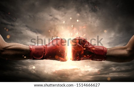 Boxing fight, close up of two fists hitting each other over dark, dramatic sky with copy space Foto stock © 