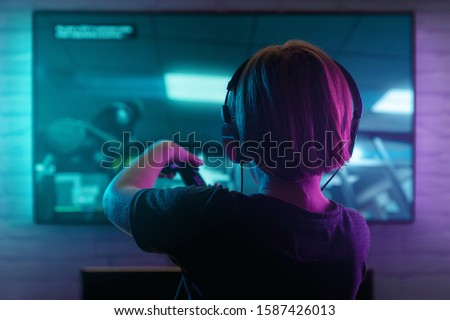 Similar – Image, Stock Photo Children playing video game in evening time