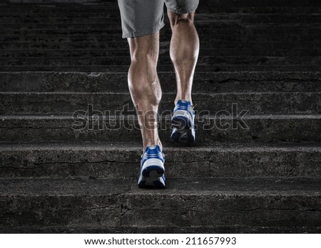 Practice, close up of young man running up the stairs