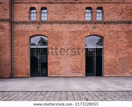 Similar – Foto Bild Fassade aus Backsteinbau und blühenden Bäumen