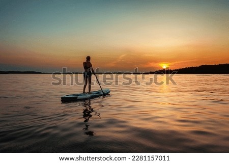 Similar – Image, Stock Photo Woman with boat standing in river