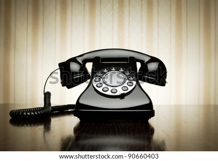 Vintage telephone over striped wallpaper