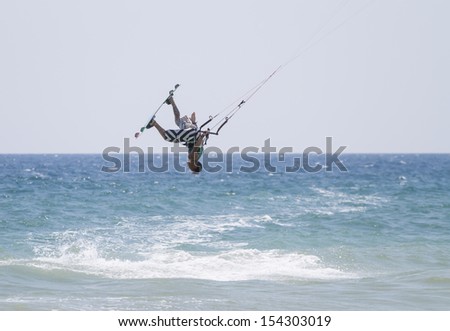 rider performing a jump on the ocean waves