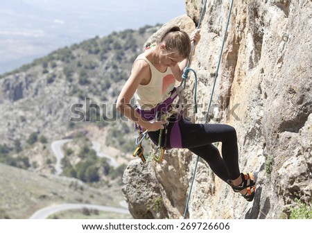 Woman practicing climbing