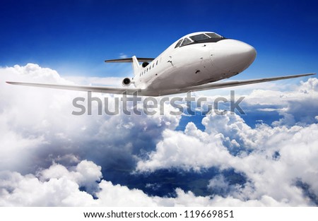 Private jet plane in the blue sky