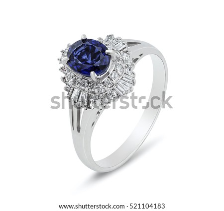 Diamond ring. Diamond ring with sapphire isolated on white background. Ring with diamonds and  large sapphire. Golden wedding rings.  Imagine de stoc © 