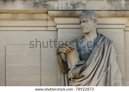 statue of Roman man reading a scroll