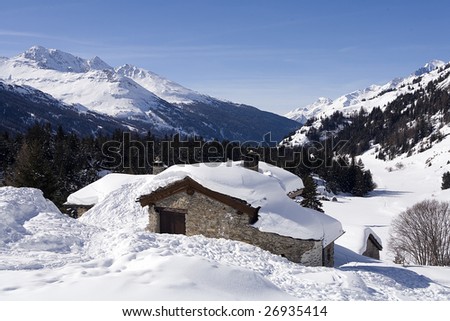 Chalet covered with snow in mountain during winter