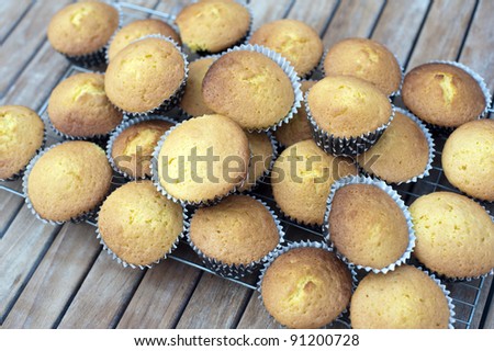 a stack of fresh baked party cakes on a cooling tray