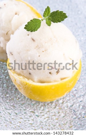 lemon sorbet with lavender in cups of lemon