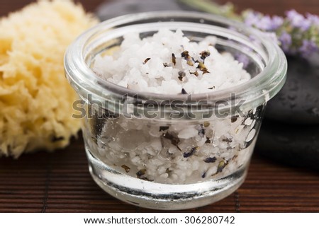 Homemade skin exfoliant (skin scrub) of sea salt, olive oil and lavender flowers
