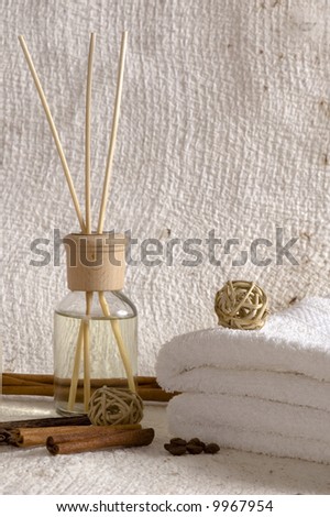 aroma therapy objects. bottle of esential oil, candles, bath-salt, towels, coffee, vanilla, anise - stars