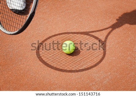 tennis racket shadow with ball