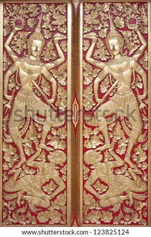 Red and gold ornate Temple doors  Thailand