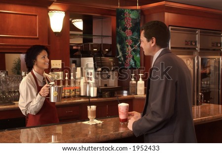 woman serving a businessman in a coffee shop