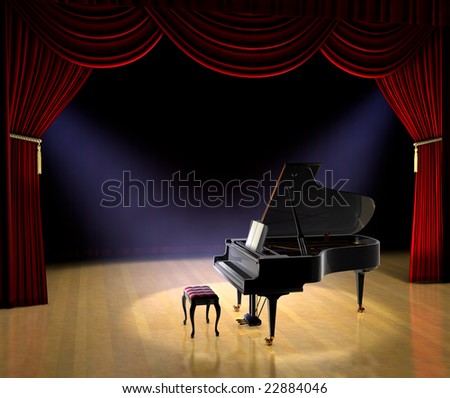 Piano on theatre stage with red curtain and spotlights on the stage floor