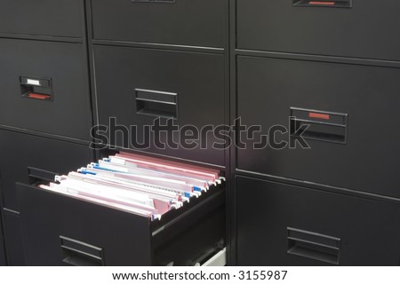 Rows of file cabinet with a drawer opened