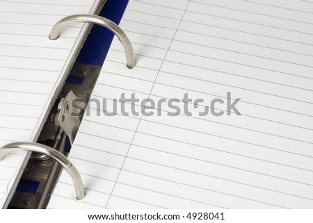 Closeup of a ring file with blank writing paper
