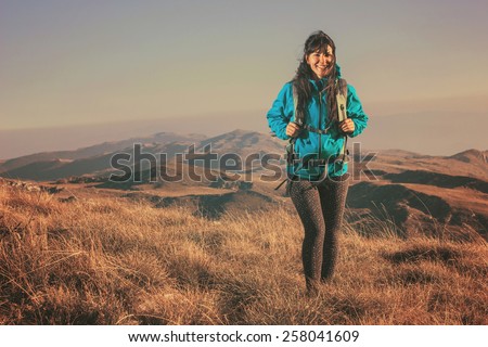 Woman hiking in beautiful nature, recreation and healthy lifestyle outdoors in wild. Hiker backpacker walking on mountain top.